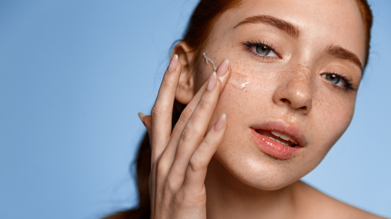 Woman putting gel moisturizer on