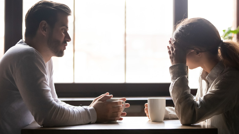 couple talking in coffee shop