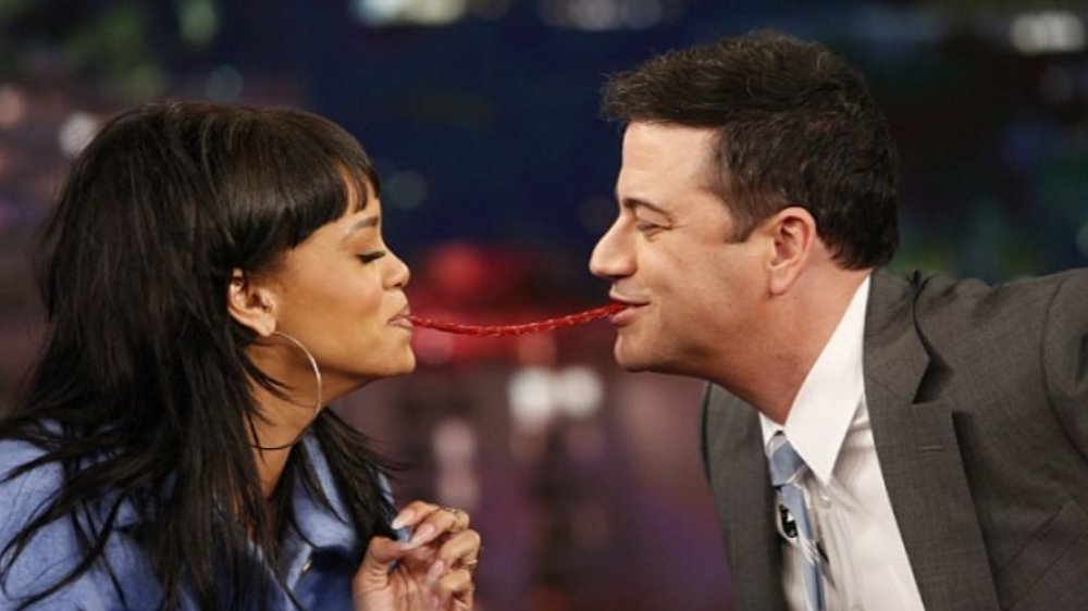 Rihanna and Jimmy Kimmel sharing a Twizzler on live TV