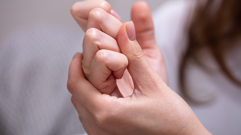 woman cracking her knuckles