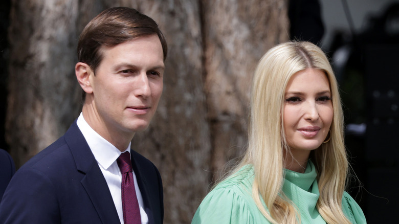 Jared Kushner and Ivanka Trump walking and squinting