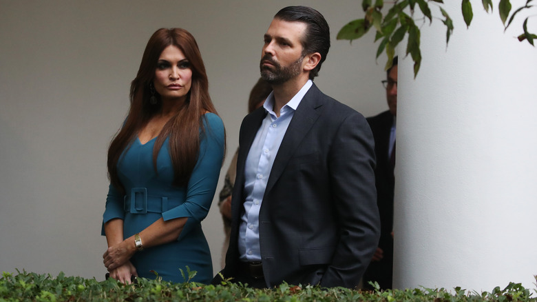 Kimberly Guilfoyle and Donald Trump Jr. looking serious