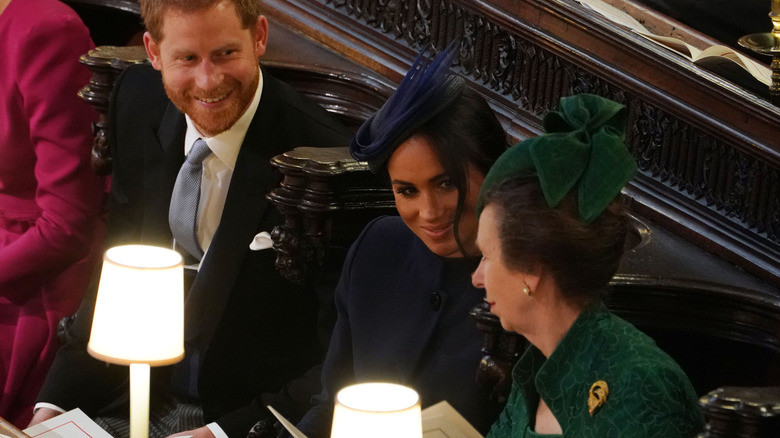 Prince Harry, Meghan Markle and Princess Anne chatting