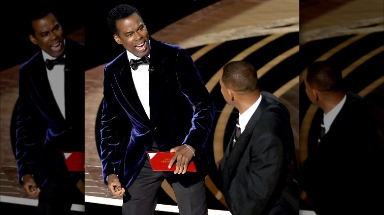 Chris Rock and Will Smith having a heated exchange at the Oscars