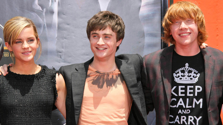 Emma Watson, Daniel Radcliffe, Rupert Grunt posing