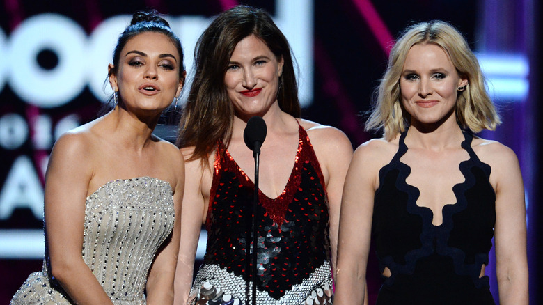 Mila Kunis, Kathryn Hahn and Kristen Bell speaking onstage during the 2016 Billboard Music Awards