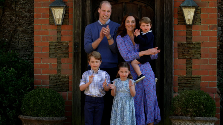William, Kate, and their children posing 