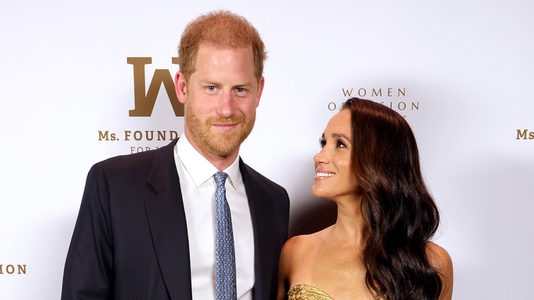 Meghan Markle looking lovingly up at Prince Harry