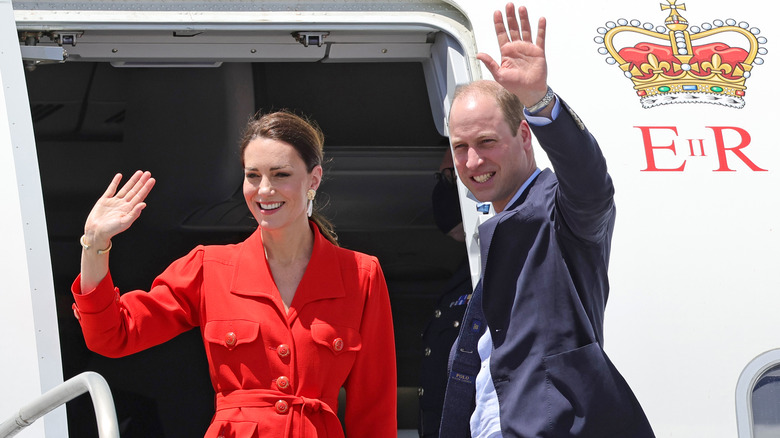Prince William and Kate Middleton waving from a plane on the royal tour