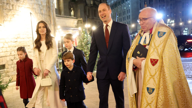 Prince William and Kate Middleton walking with their children