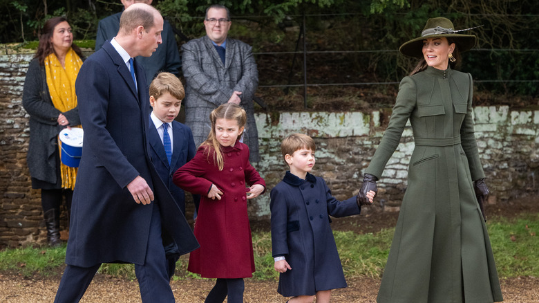 The Cambridge family walking outside