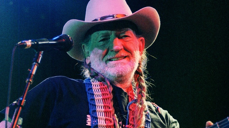 Willie Nelson playing guitar