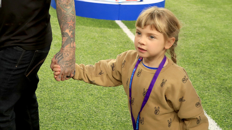 Willow holding Carey's hand