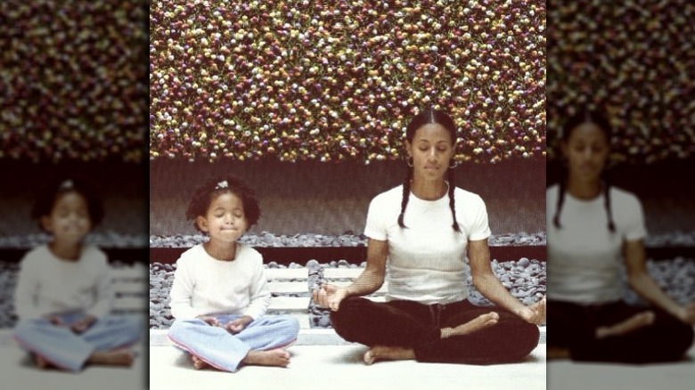 Young Willow Smith meditating with mom Jada Pinkett Smith