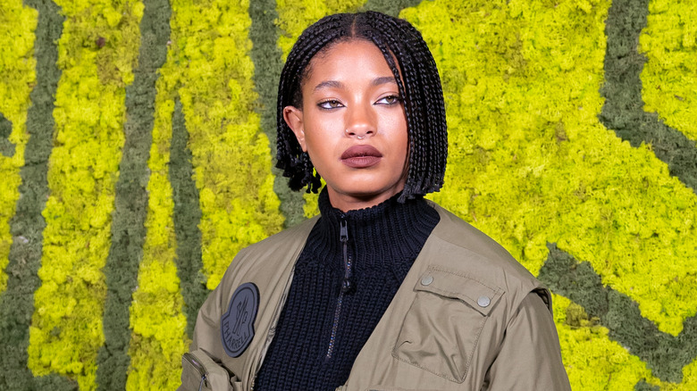 Willow Smith on red carpet with yellow background