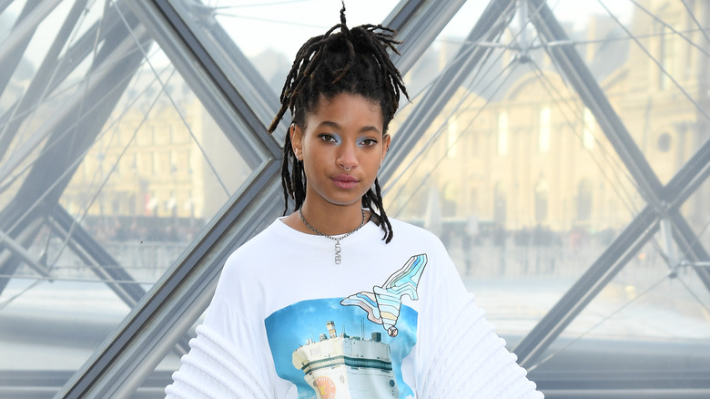 Willow Smith posing for camera in white shirt