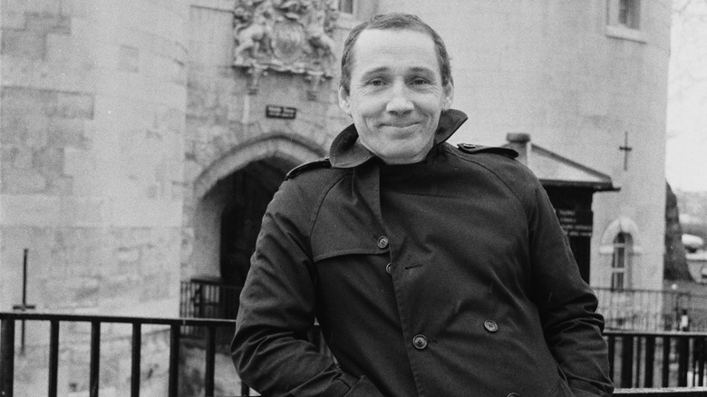 Michael Fagan smiling outside Buckingham Palace