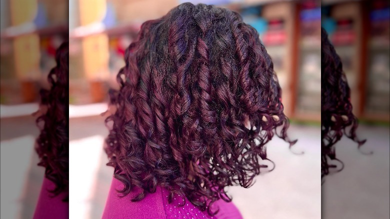 Dark cranberry hair in curls