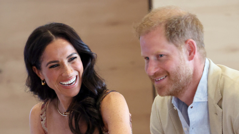 Meghan Markle laughing with Prince Harry