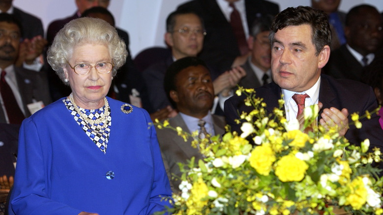 Queen Elizabeth II sitting next to Prime Minister Gordon Brown