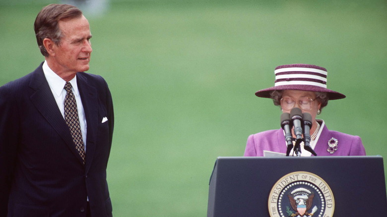 Queen Elizabeth II giving speech next to President George H. W. Bush