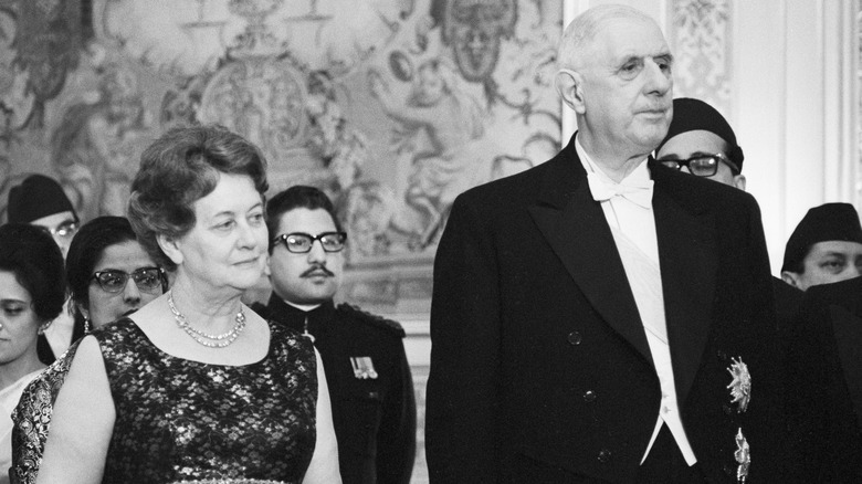 Charles and Yvonne de Gaulle standing in crowd