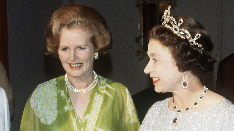 Queen Elizabeth II smiling with Prime Minister Margaret Thatcher