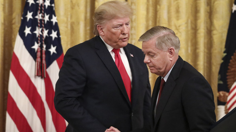 Donald Trump shaking Lindsey Graham's hand