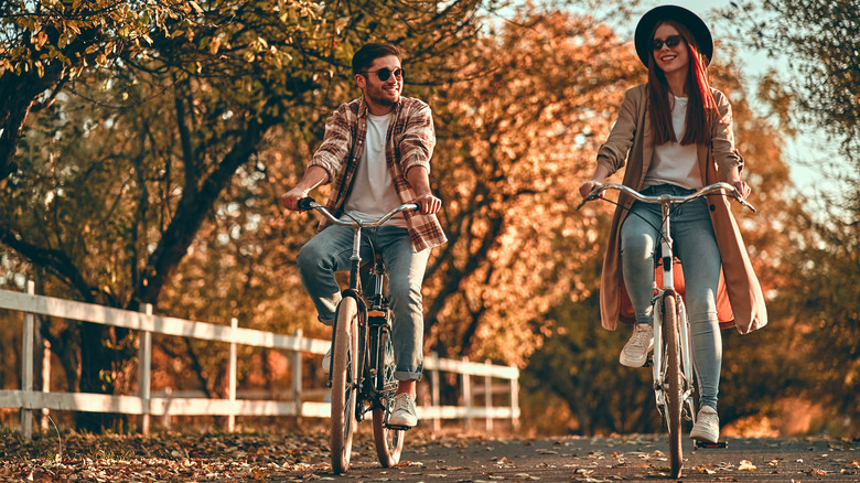 Couple riding bikes together