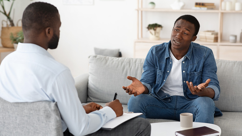 man talking to therapist