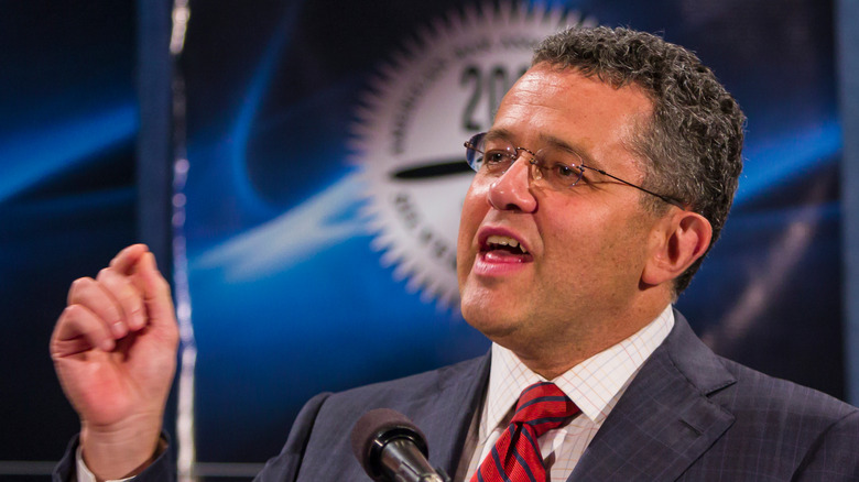 Jeffery Toobin speaking at an event in a suit