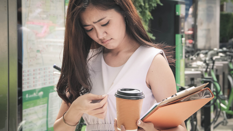 woman with coffee stain on dress