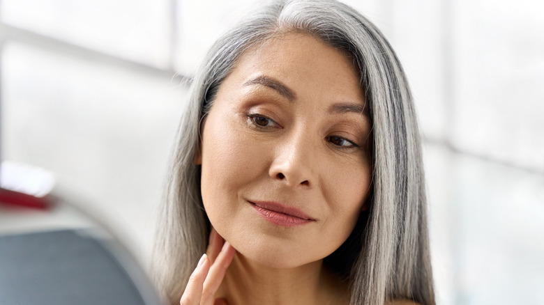 Woman admiring Botox results