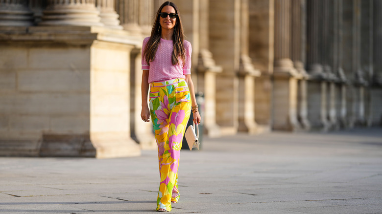 Woman wearing yellow printed pants