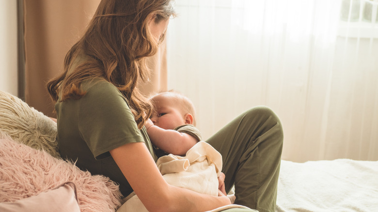 A woman breastfeeding her child