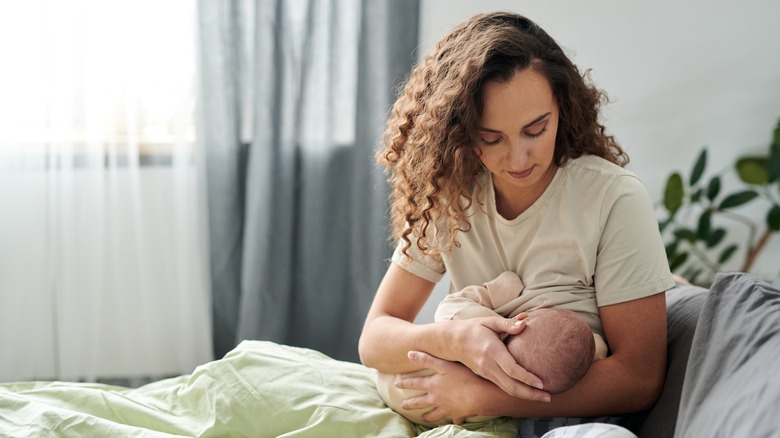 A woman breastfeeding her child