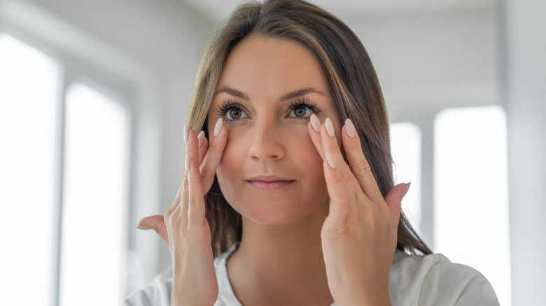 Woman rubbing the four whites area