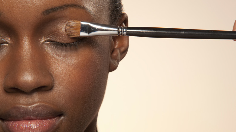 Woman applying eyeshadow 