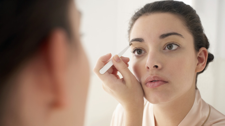 Woman looking in the mirror