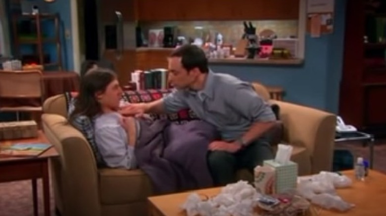 Sheldon Cooper rubs vapo on Amy Farrah Fowler