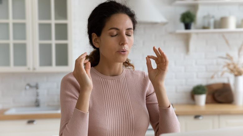 Woman doing breathing exercises