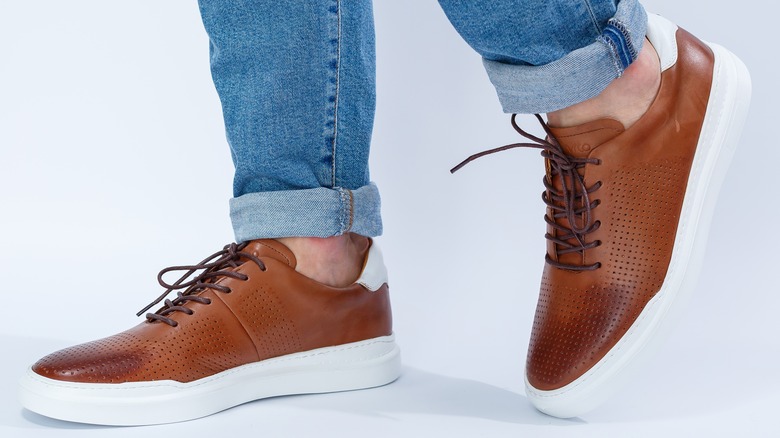 Wearing brown lace-up shoes