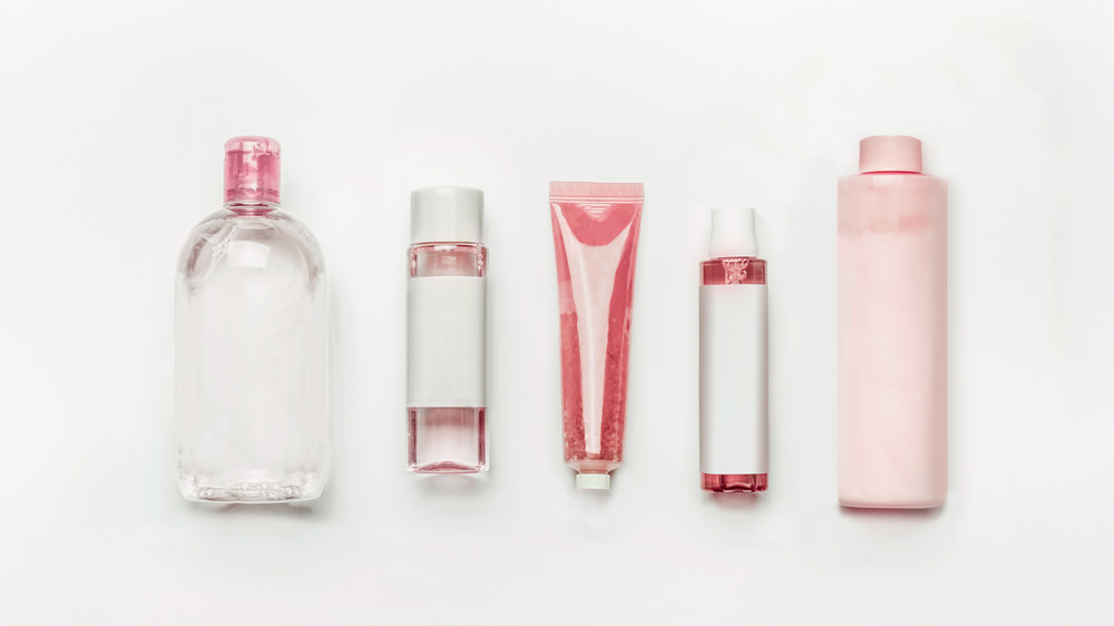 Various skincare bottles in a line