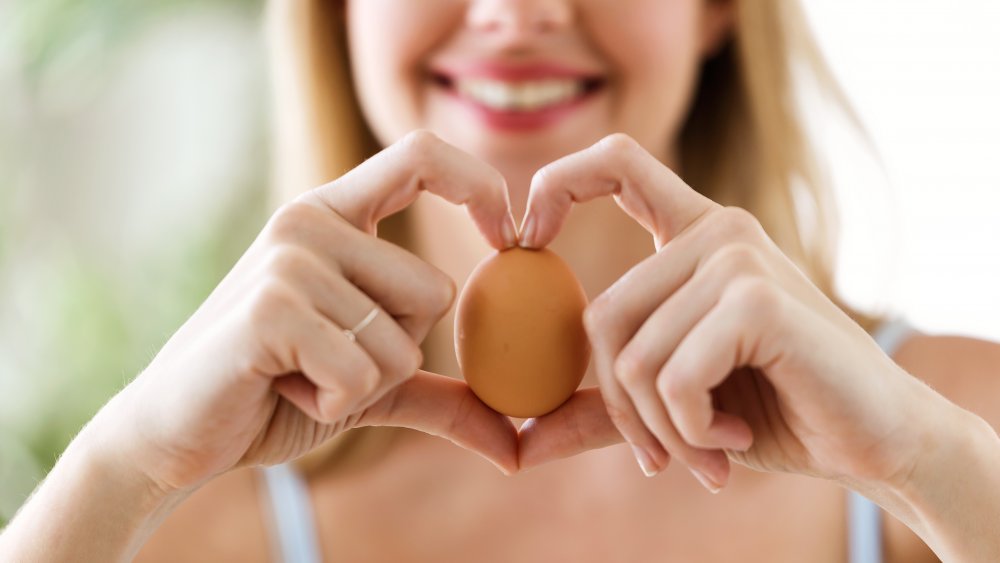 Woman holding egg