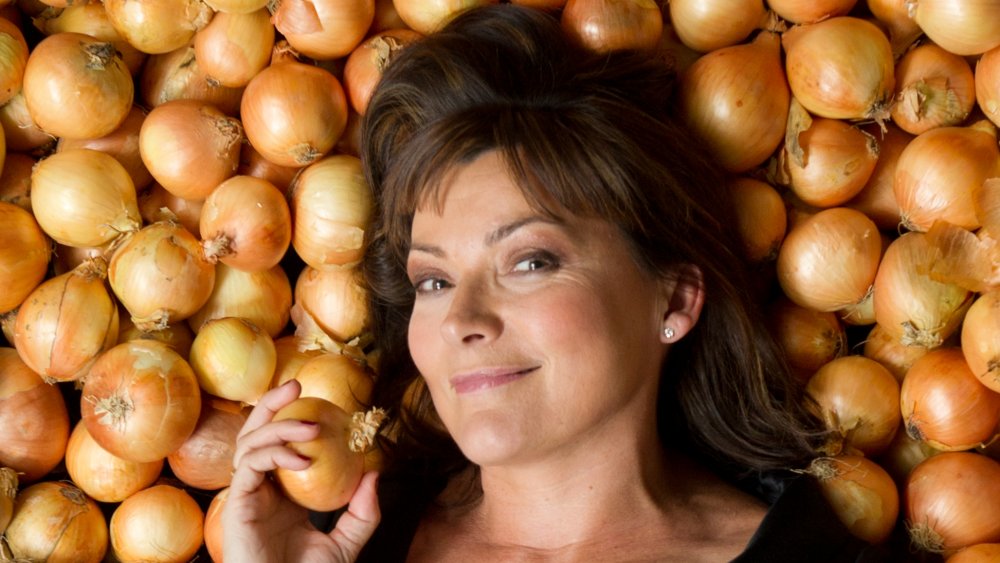 Woman lying on onions