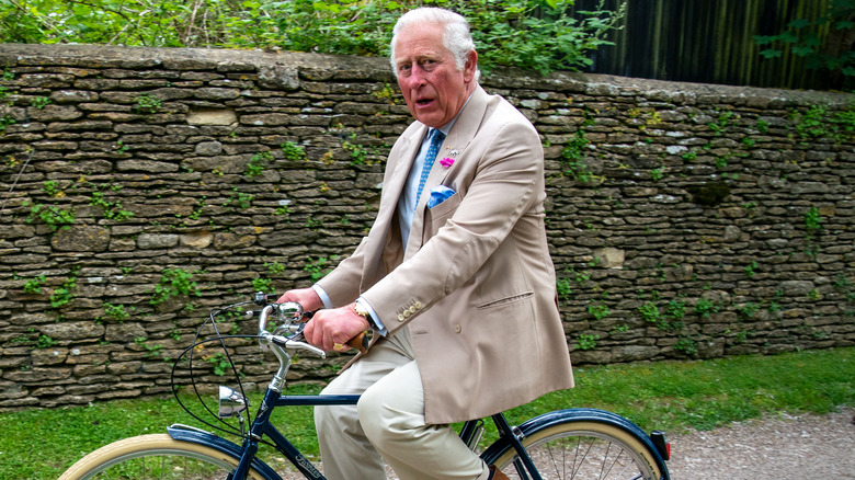 Prince Charles riding bike at Highgrove