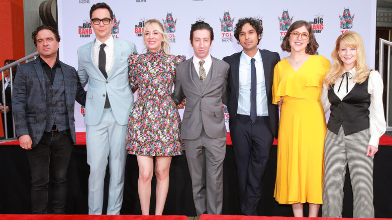 (L-R) Johnny Galecki, Jim Parsons, Kaley Cuoco, Simon Helberg, Kunal Nayyar, Mayim Bialik and Melissa Rauch pose at their 2019 handprint ceremony