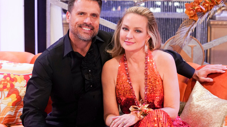 Joshua Morrow and Sharon Case smiling together 