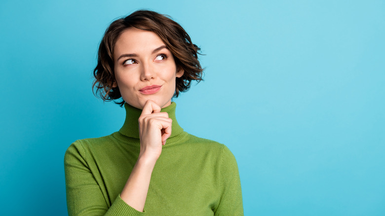 woman wearing green turtleneck