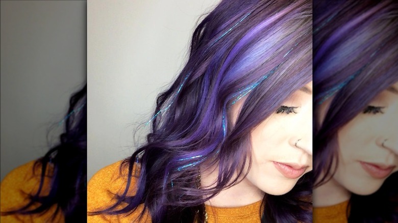 woman with purple hair and blue hair tinsel